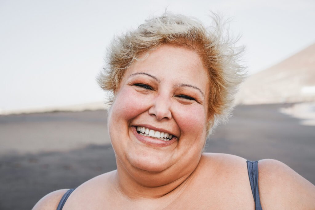 portrait of curvy woman smiling on camera wearing 2025 02 21 21 00 26 utc